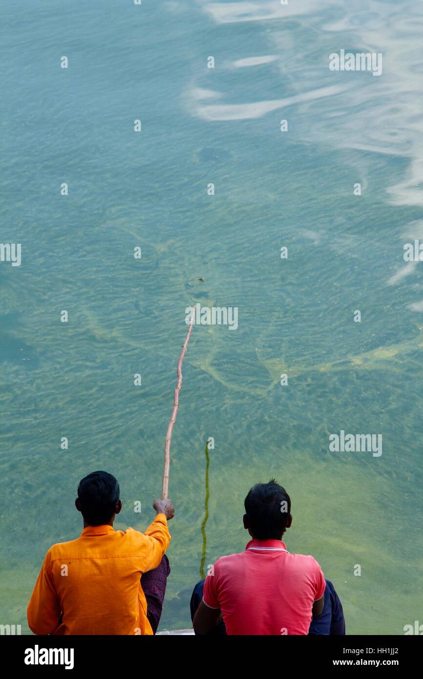 Two men fishing in India Stock Photo