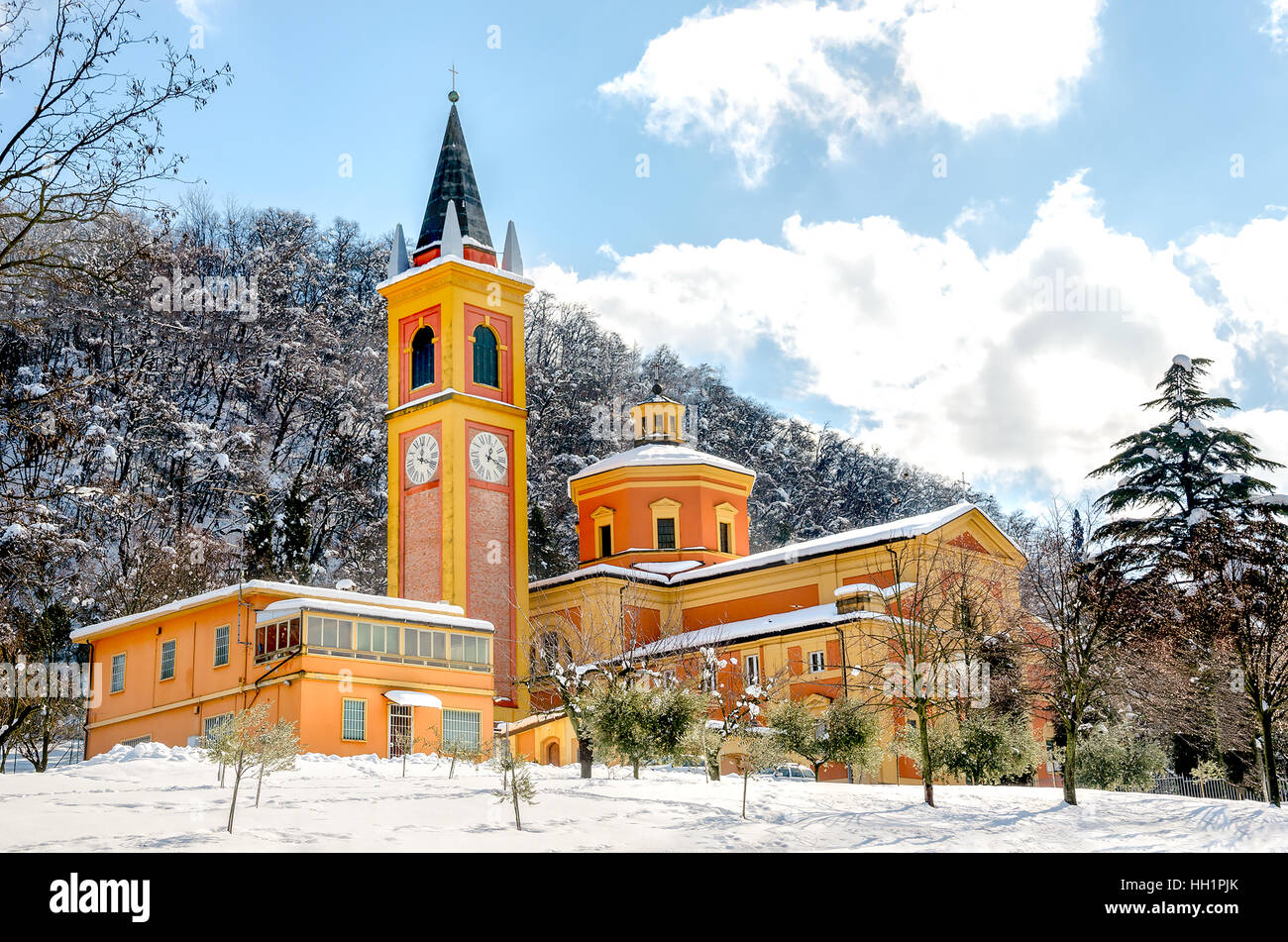church snow covered colorful orange yellow Stock Photo