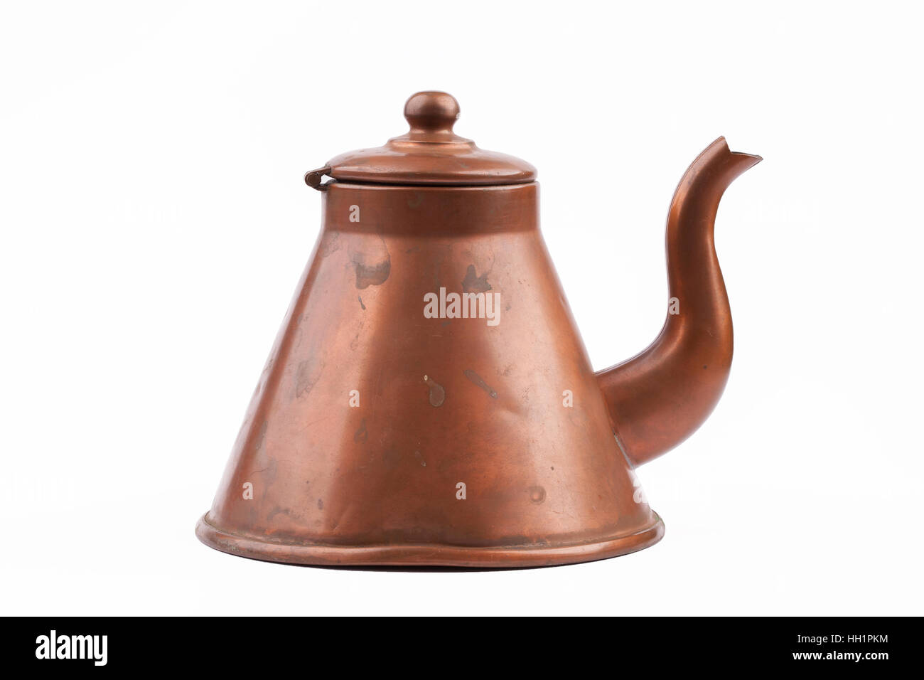 Antique old copper tea kettle isolated on white background Stock Photo
