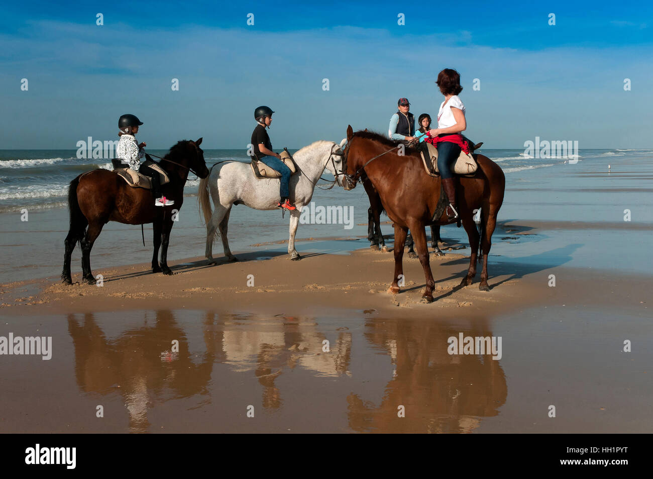 Equestrian tourism on the beach, Donana Natural Park, Matalascanas, Huelva province, Region of Andalusia, Spain, Europe Stock Photo