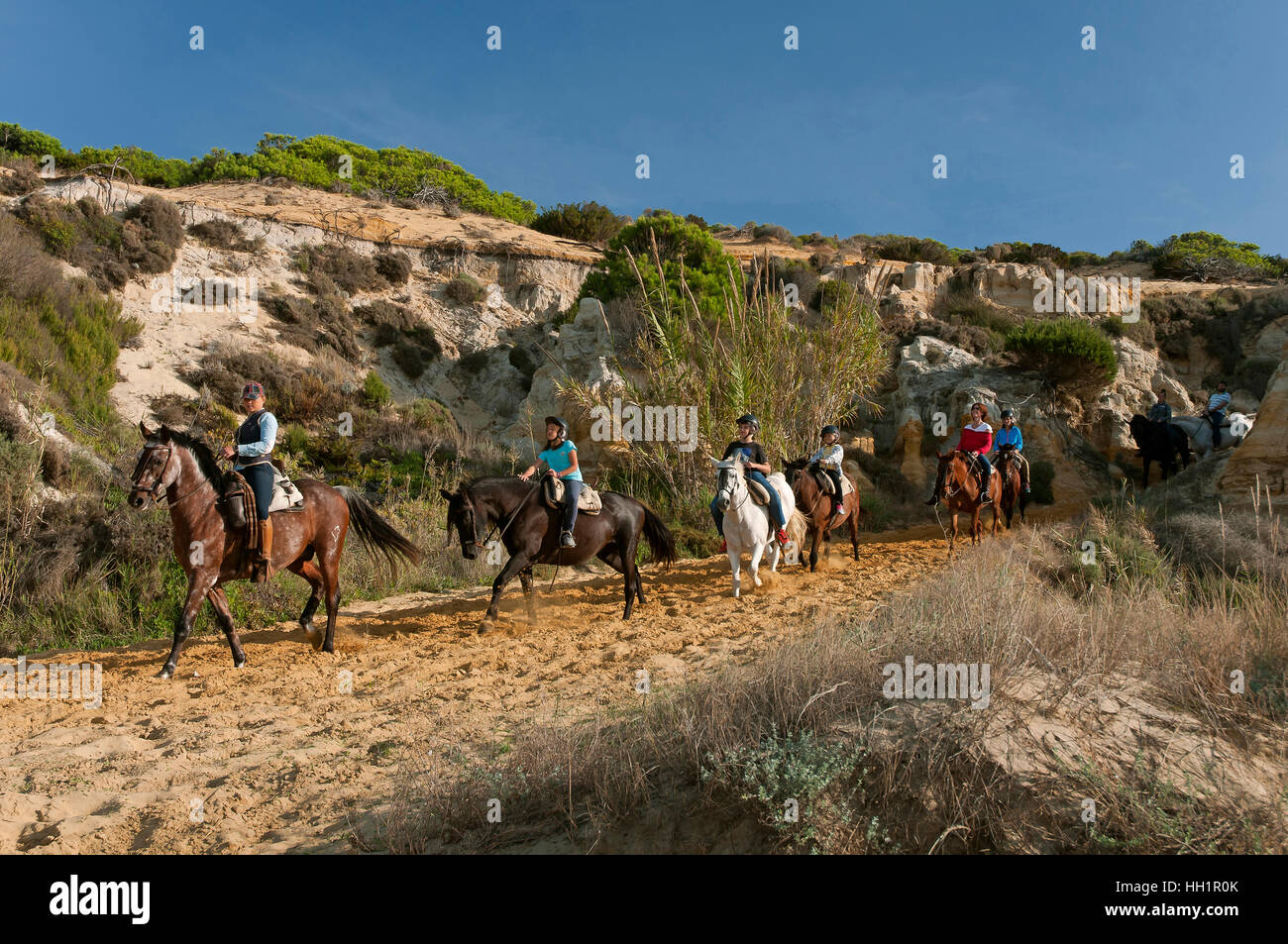 Equestrian tourism on the Asperillo dunes, Doñana Natural Park, Matalascañas, Huelva province, Region of Andalusia, Spain, Europe Stock Photo