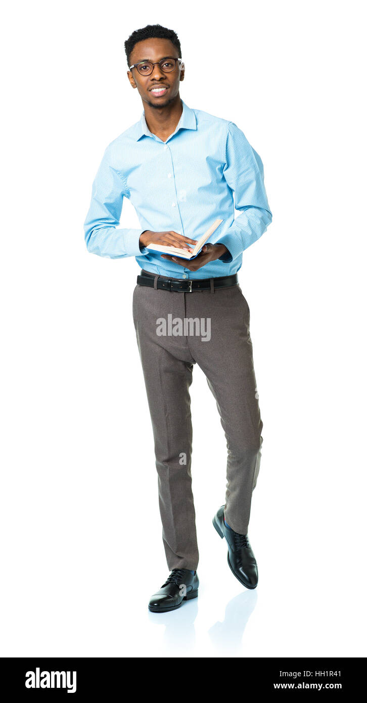 Happy african american college student standing with book on white background Stock Photo