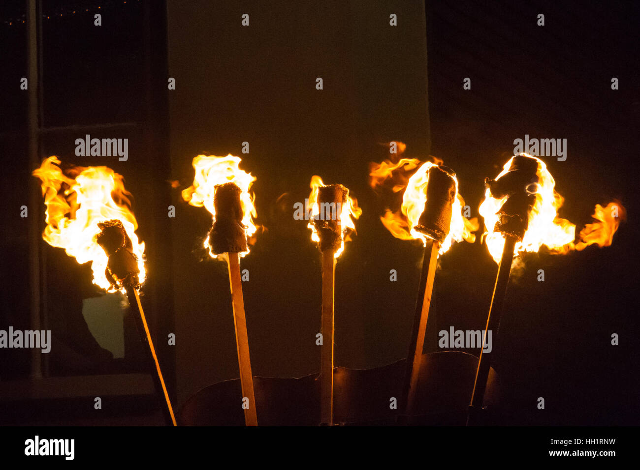A photograph of 5 burning fire torches Stock Photo