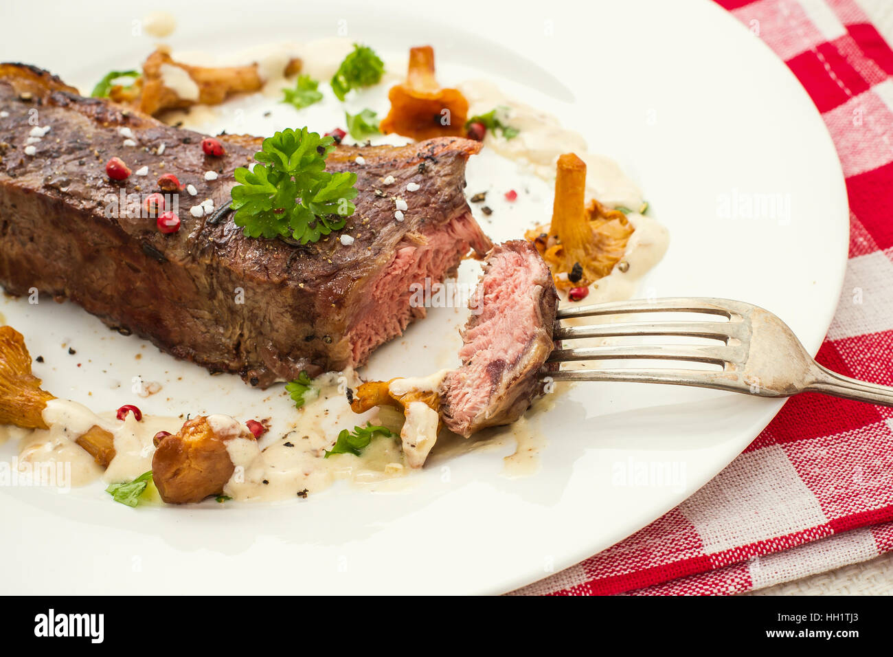 Grilled rump steak with chanterelle mushrooms and cream sauce Stock Photo Alamy