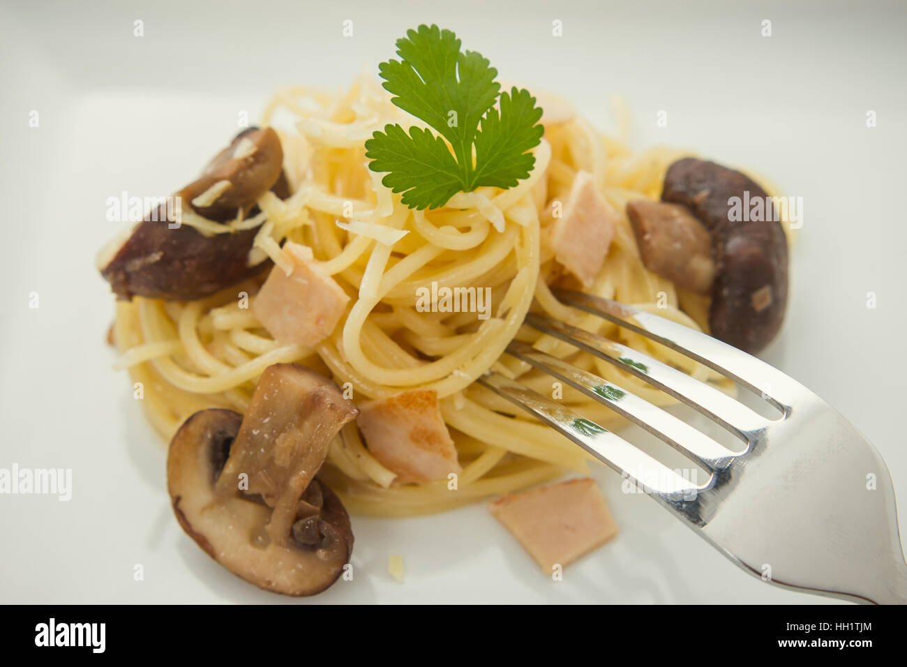 Spaghetti carbonara with mushroom, macro, soft focus Stock Photo