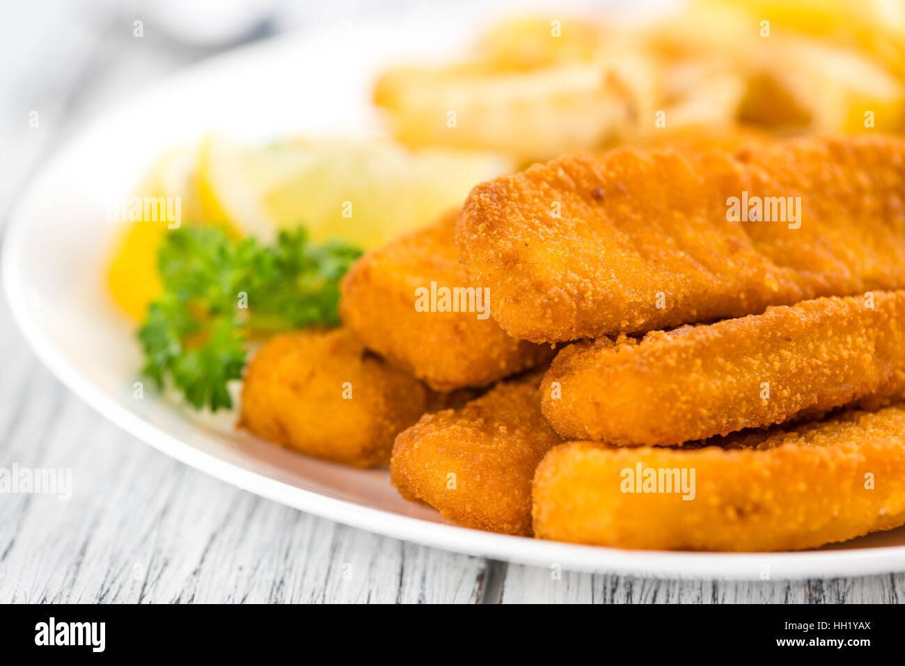 Some fried Fish Sticks (selective focus) on an old wooden table Stock ...