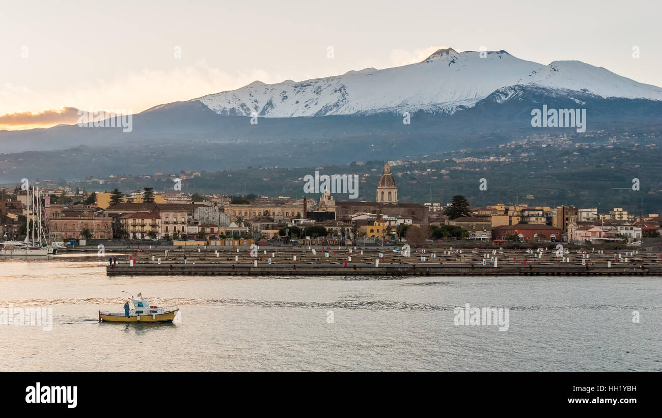 The marina of Riposto during the sunset; volcano Etna in the background Stock Photo