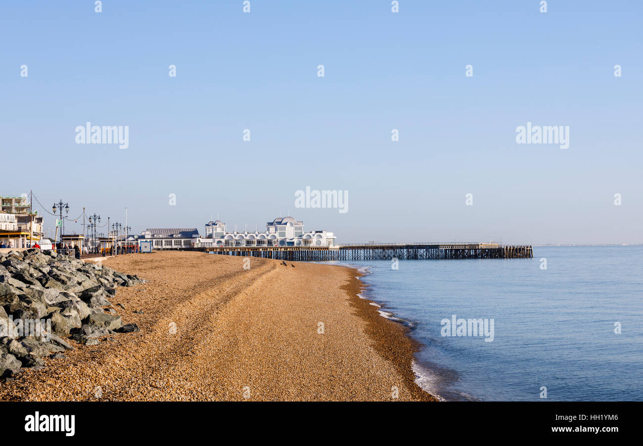 South Parade Pier and the stony beach at Southsea, Portsmouth, Hampshire, southern England on a sunny winter day with blue sky Stock Photo