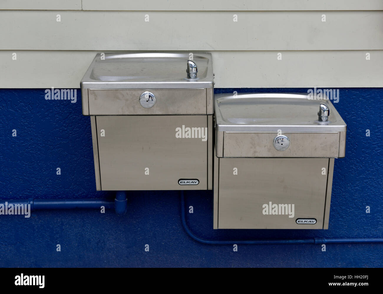 Two drinking water fountains at different heights Stock Photo Alamy