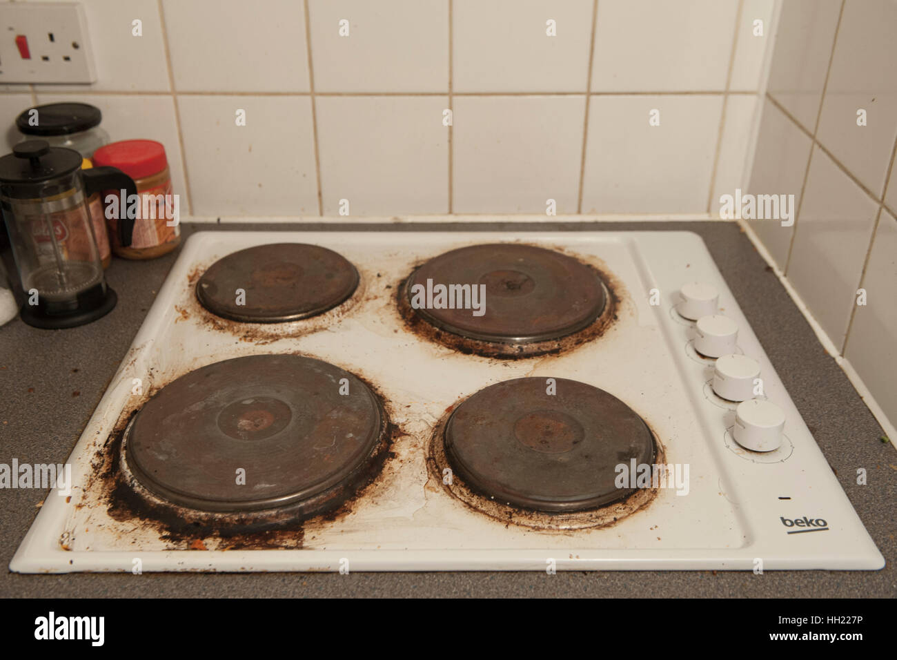 A filthy cooker hob in a student house Stock Photo