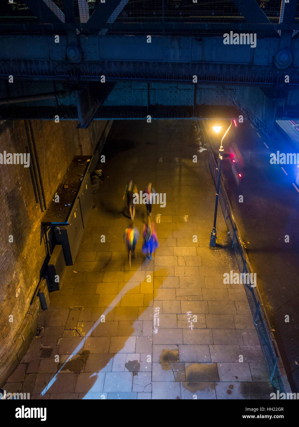 Jogging at night in London under a streetlight Stock Photo Alamy