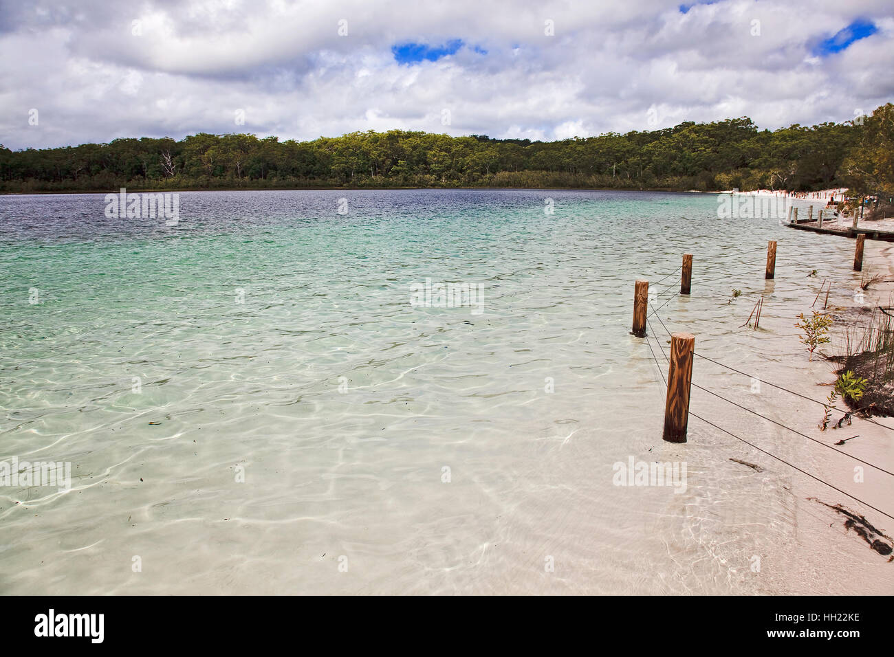 Remote shallow white sand beach on MacKenzie fresh water lake of Fraser Island national park in Queensland, Australia. Stock Photo