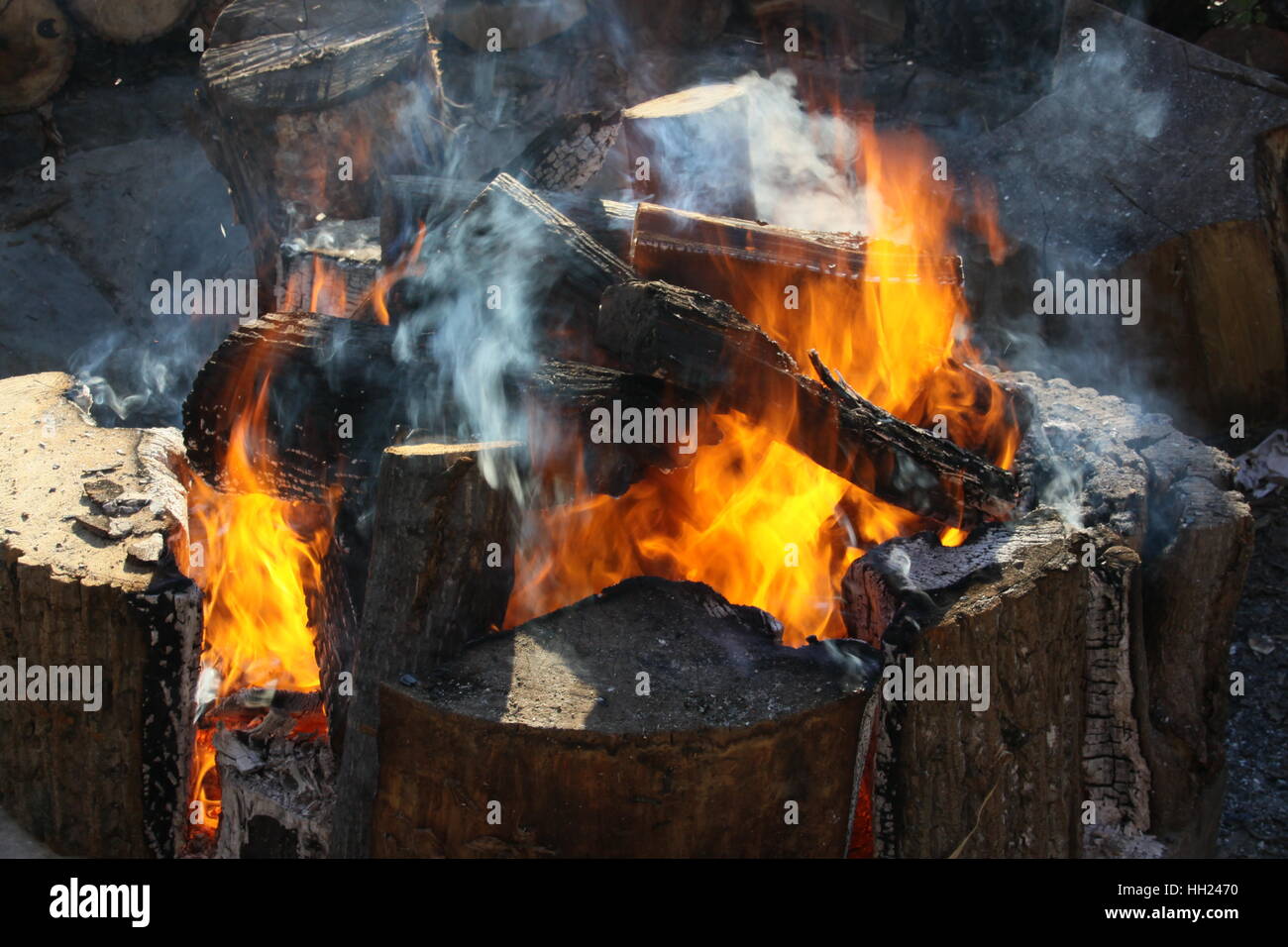 Flames from wood burning in a fire pit Stock Photo Alamy