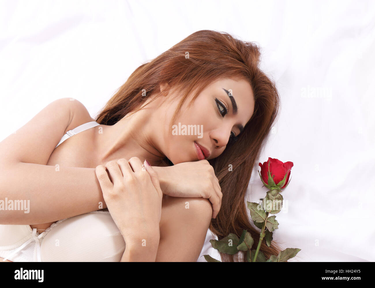 closeup image of beautiful woman and red rose on white background Stock Photo