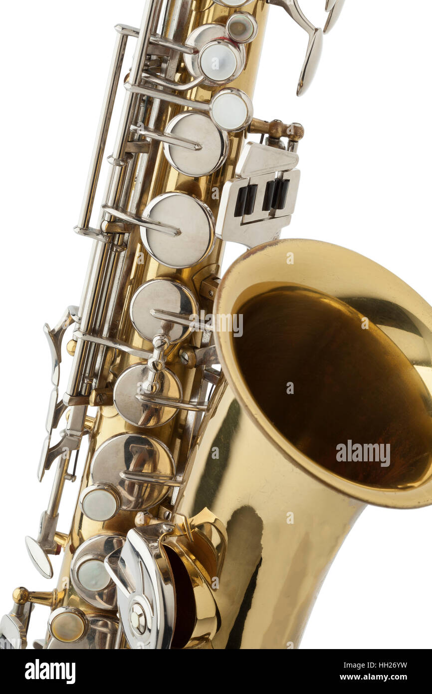 Details of a shiny bronze saxophone close up on white background Stock Photo