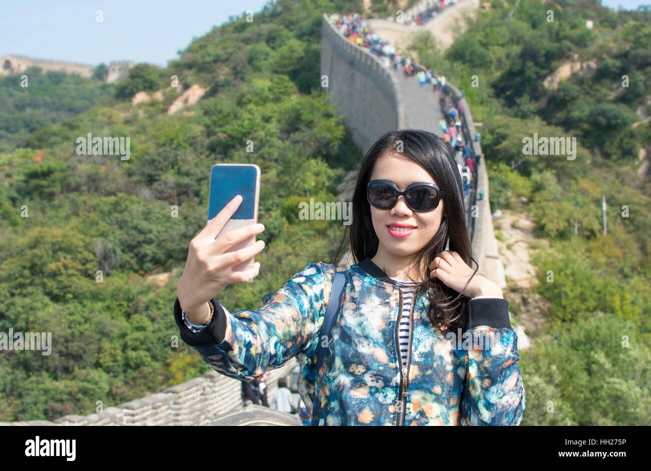 Girl taking selfie at the Great wall of China Stock Photo