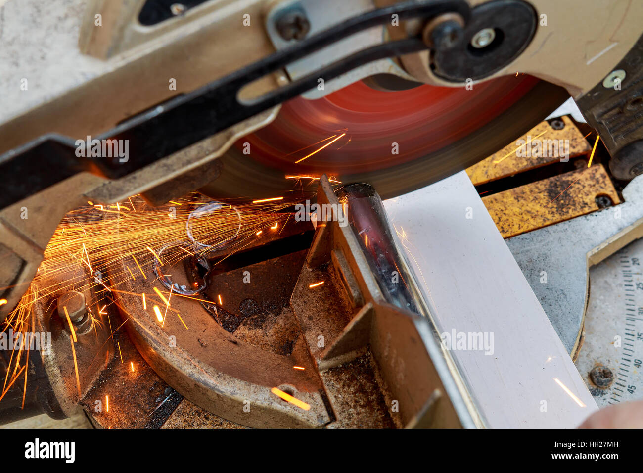 industrial engineer working on cutting a metal and steel with compound
