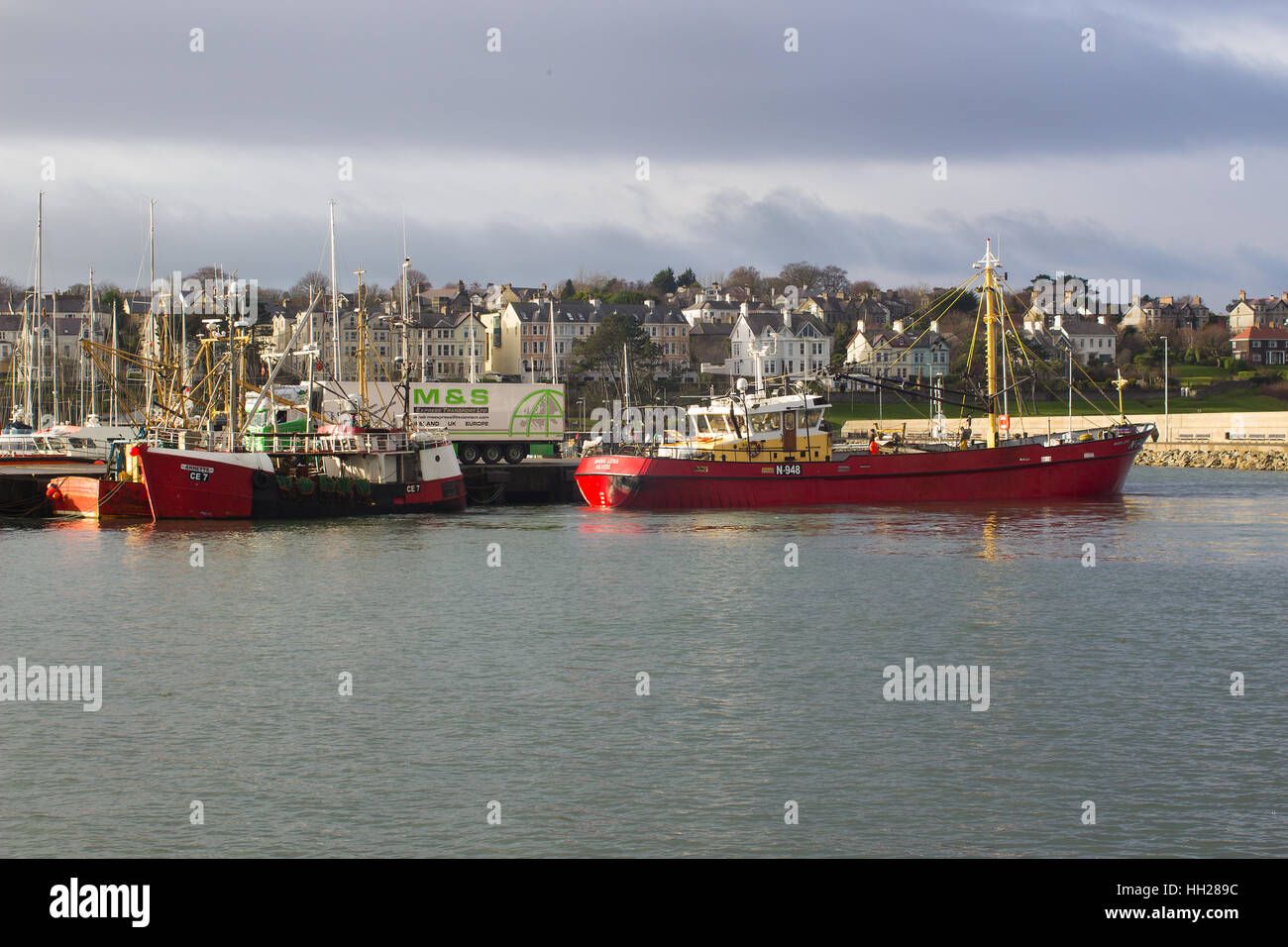 The trawler Maria Lena of Kilkeel manoeuvres to her berth in the harbor in Bangor Northern Ireland on a pleasant winter's day Stock Photo