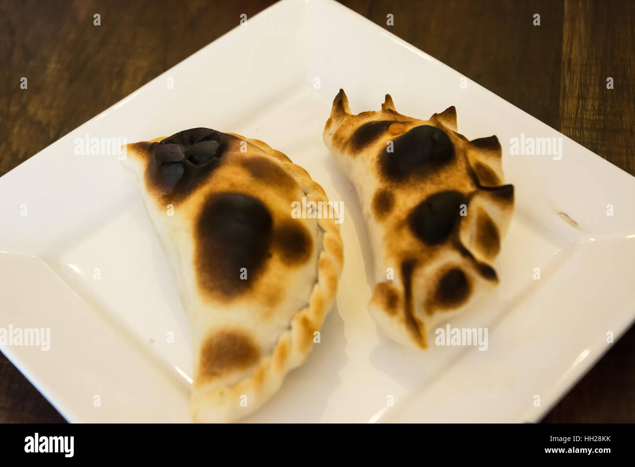 Argentinian empanadas on white dish Stock Photo