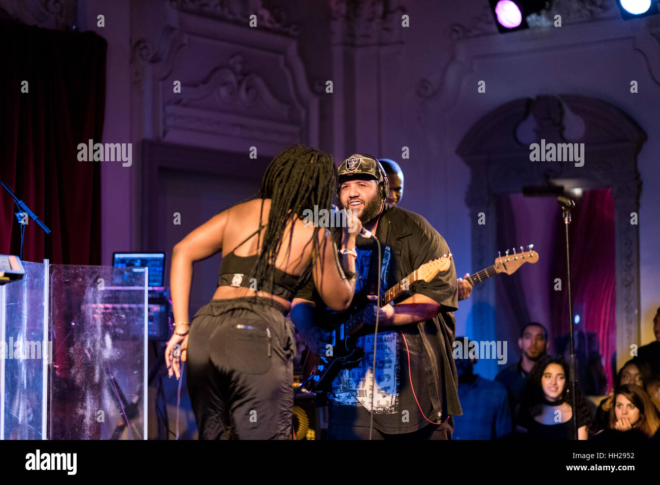Ray BLK, singer, interacting with her guitarist at a live gig in September 2016. Stock Photo