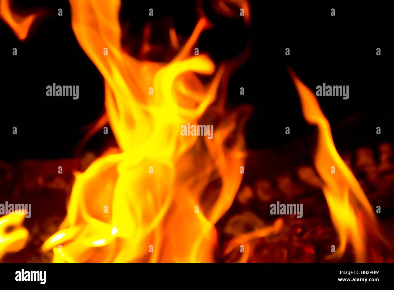 Photo of red fire flame on black background Stock Photo - Alamy