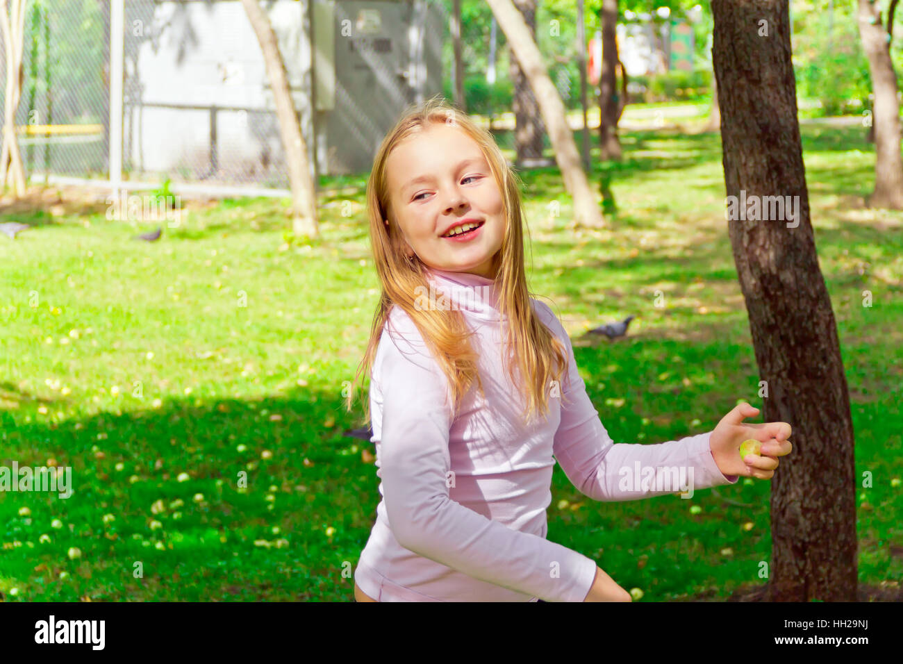 Photo of cute playing girl in summer Stock Photo - Alamy