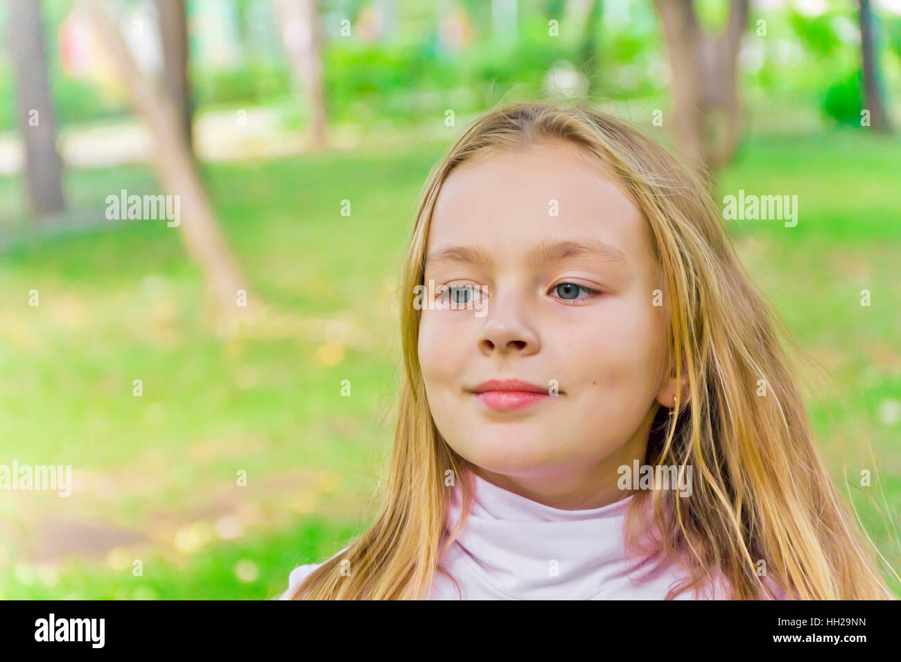 Cute girl with blond long hair and blue eyes Stock Photo - Alamy