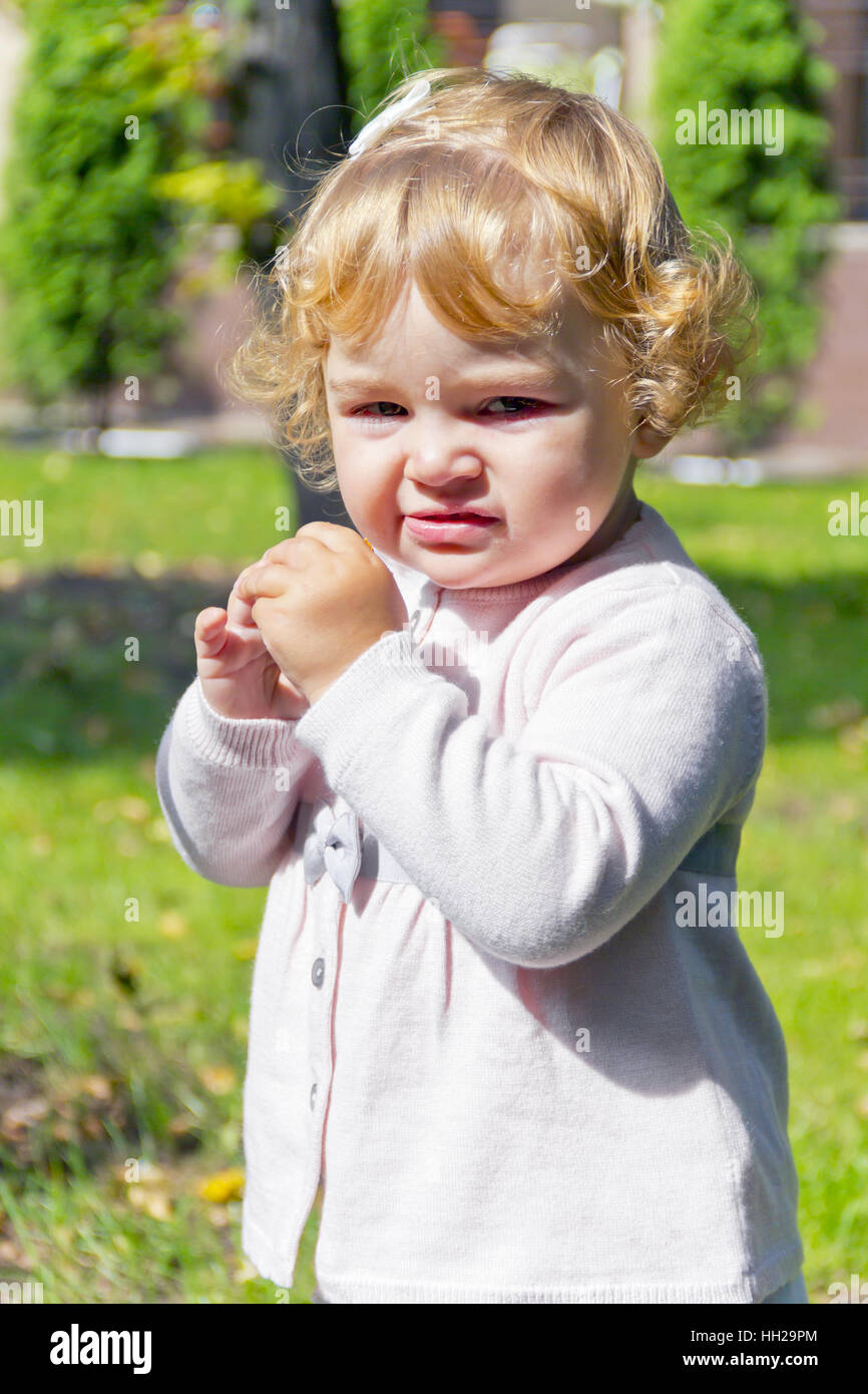 Blond baby girl eating hires stock photography and images Alamy