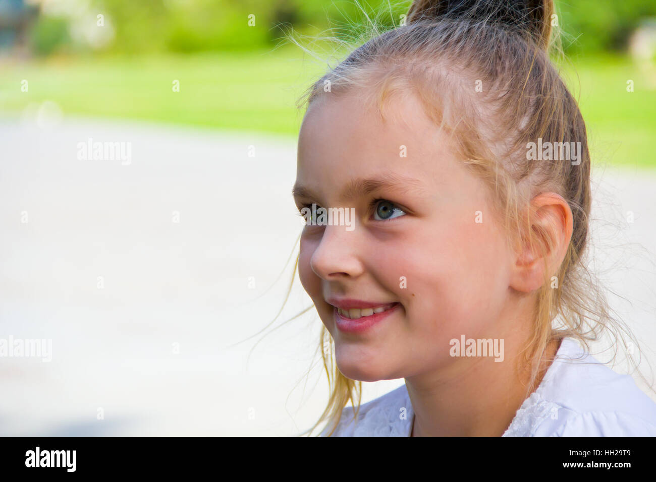 Photo of cute girl with big blue eyes Stock Photo