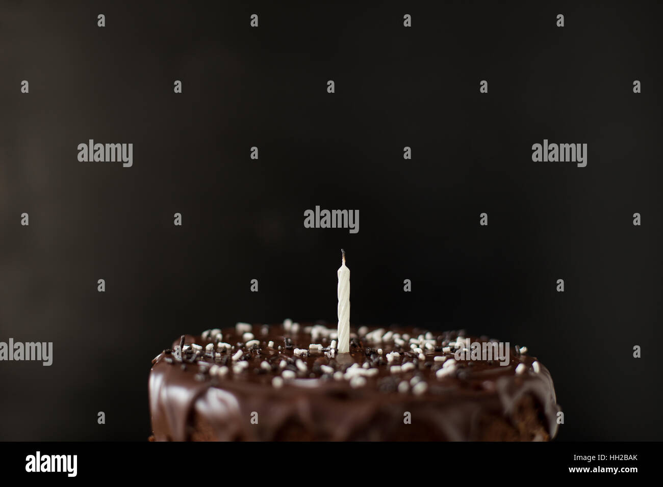 Chocolate cake with candle Stock Photo - Alamy
