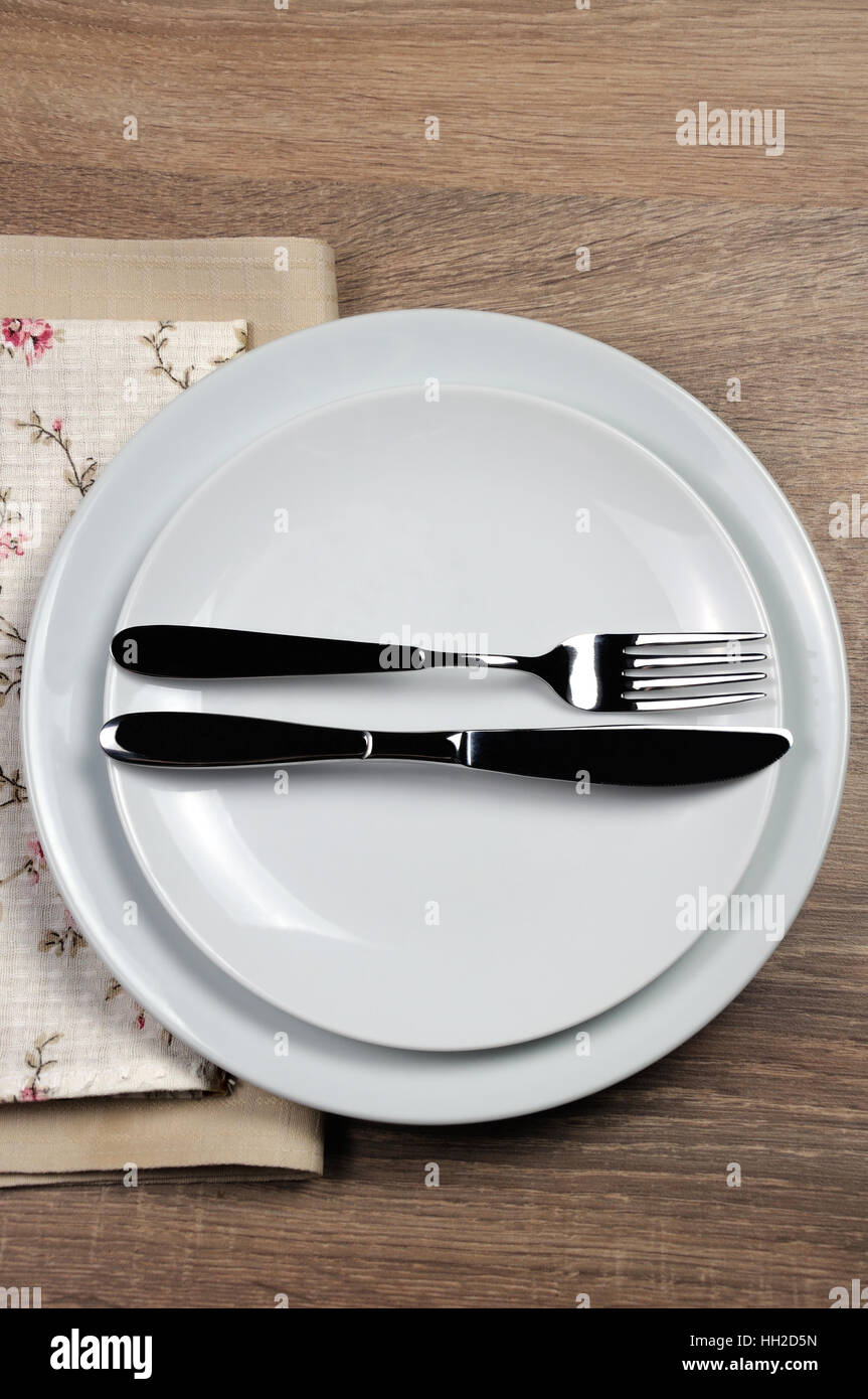Dining etiquette - I still eat, finished  . Fork and knife signals with location of cutlery set Stock Photo