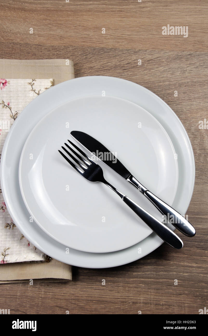 Dining etiquette - I still eat, Finished position. Fork and knife signals with location of cutlery set Stock Photo