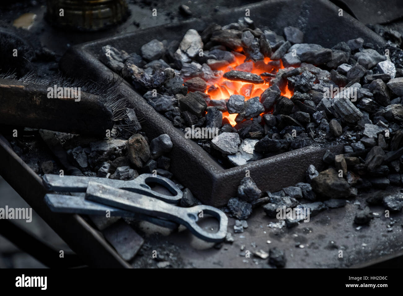 Blacksmiths coals burning for iron work Stock Photo