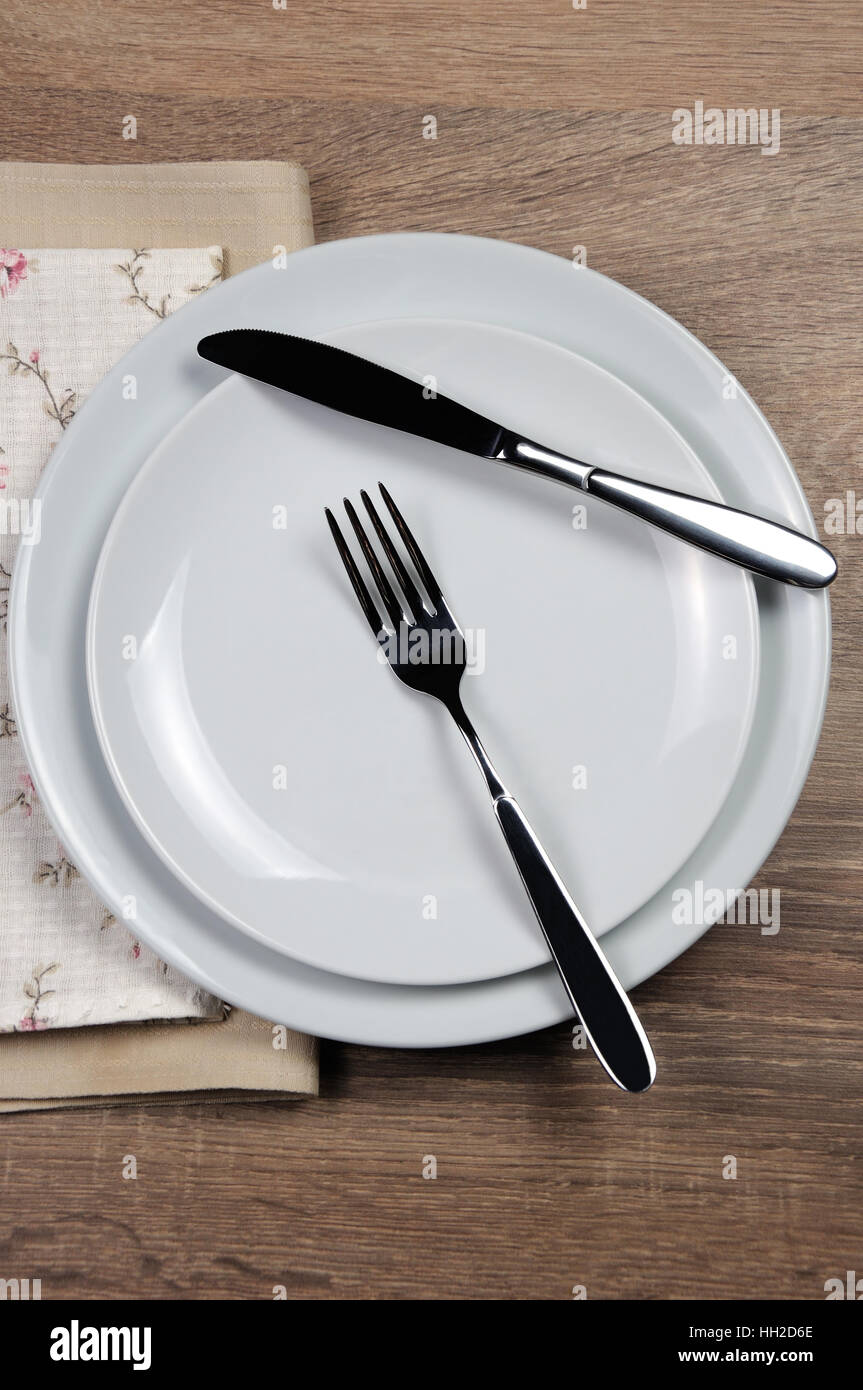 Dining etiquette - I still eat, Resting position. Fork and knife signals with location of cutlery set Stock Photo