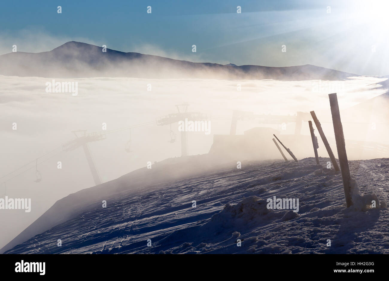 Sun over winter mountains, covered with snow Stock Photo - Alamy