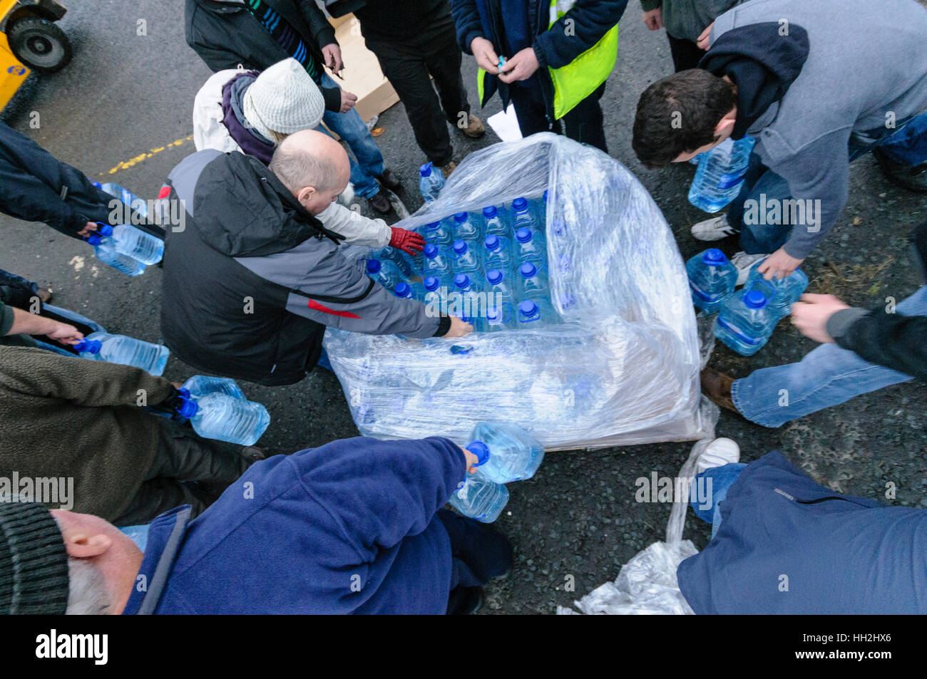 Distribution of bottled water as public start to panic over shortage of