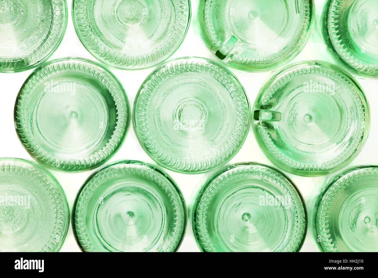 Bottoms of empty glass bottles isolated on white Stock Photo - Alamy