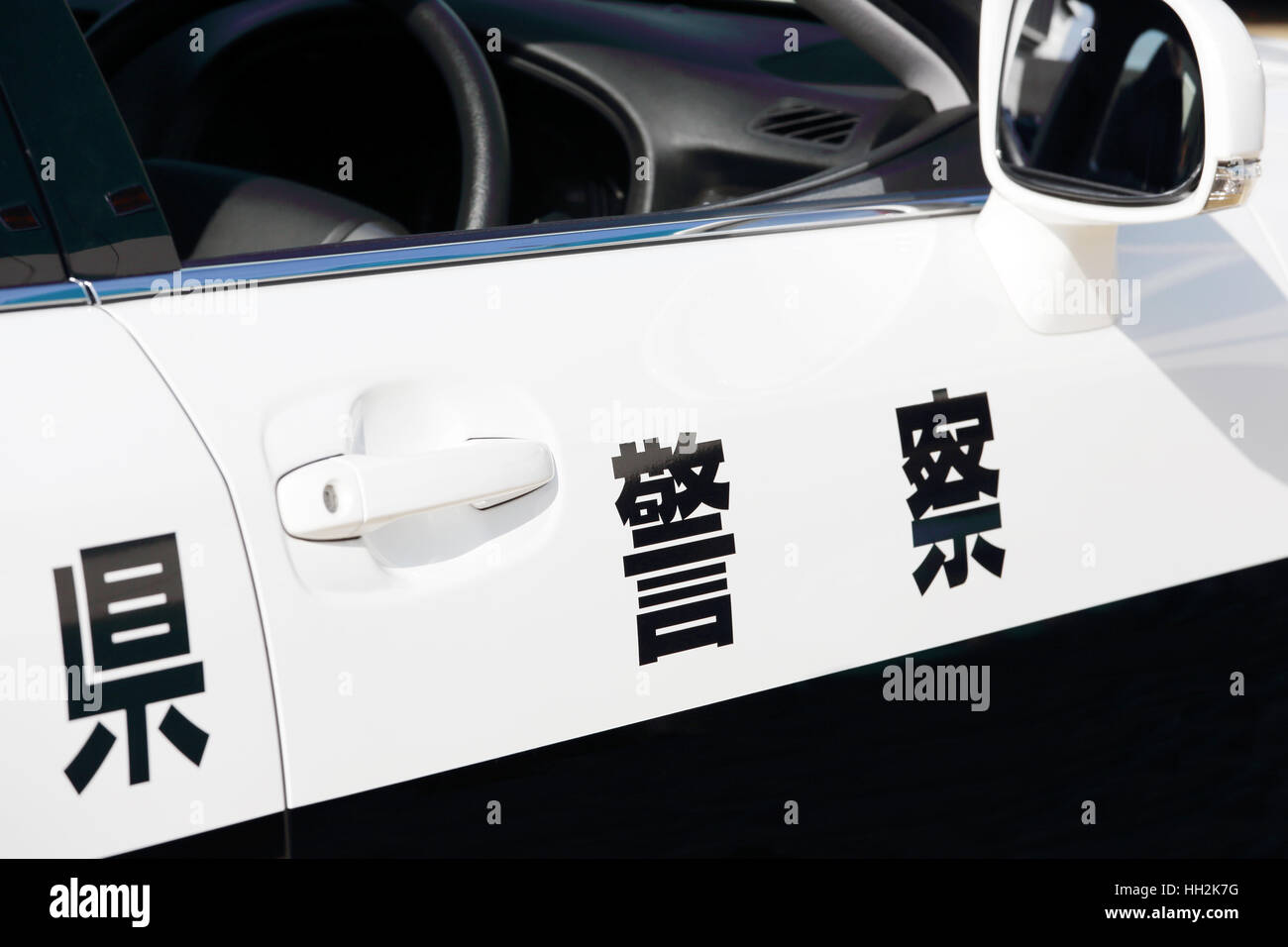Closeup of the body of the japanese police car with a sign POLICE Stock Photo