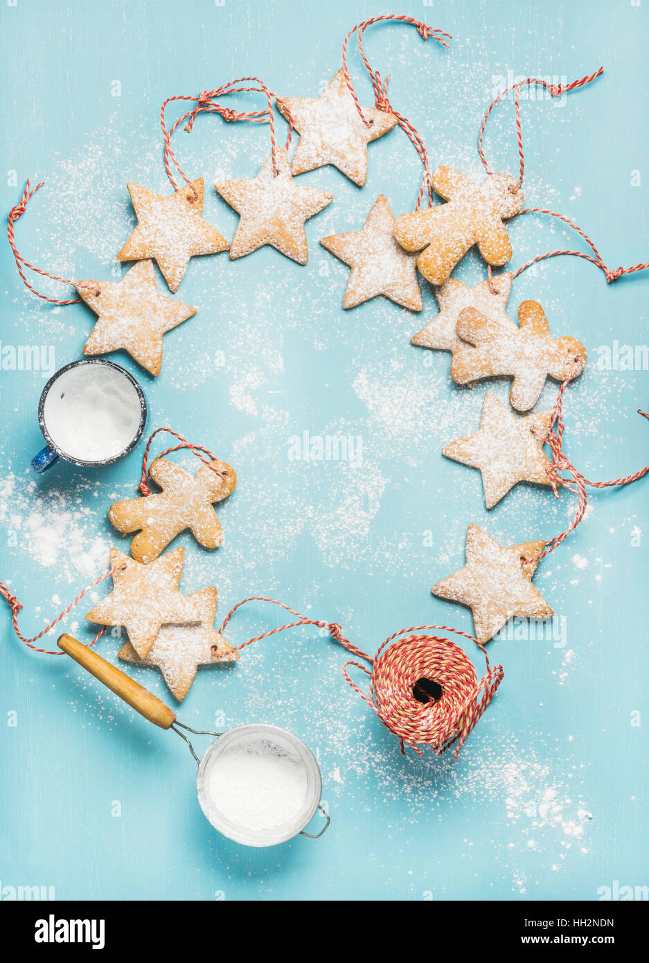Christmas gingerbread cookies with sugar powder and decoration rope Stock Photo