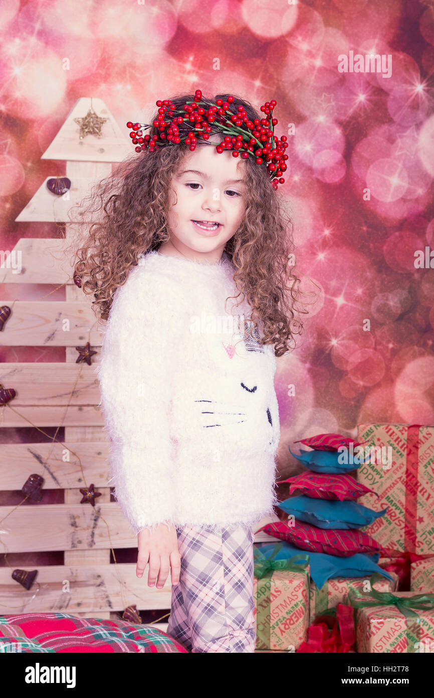 Portrait of pretty little girl in Christmas interior Stock Photo - Alamy