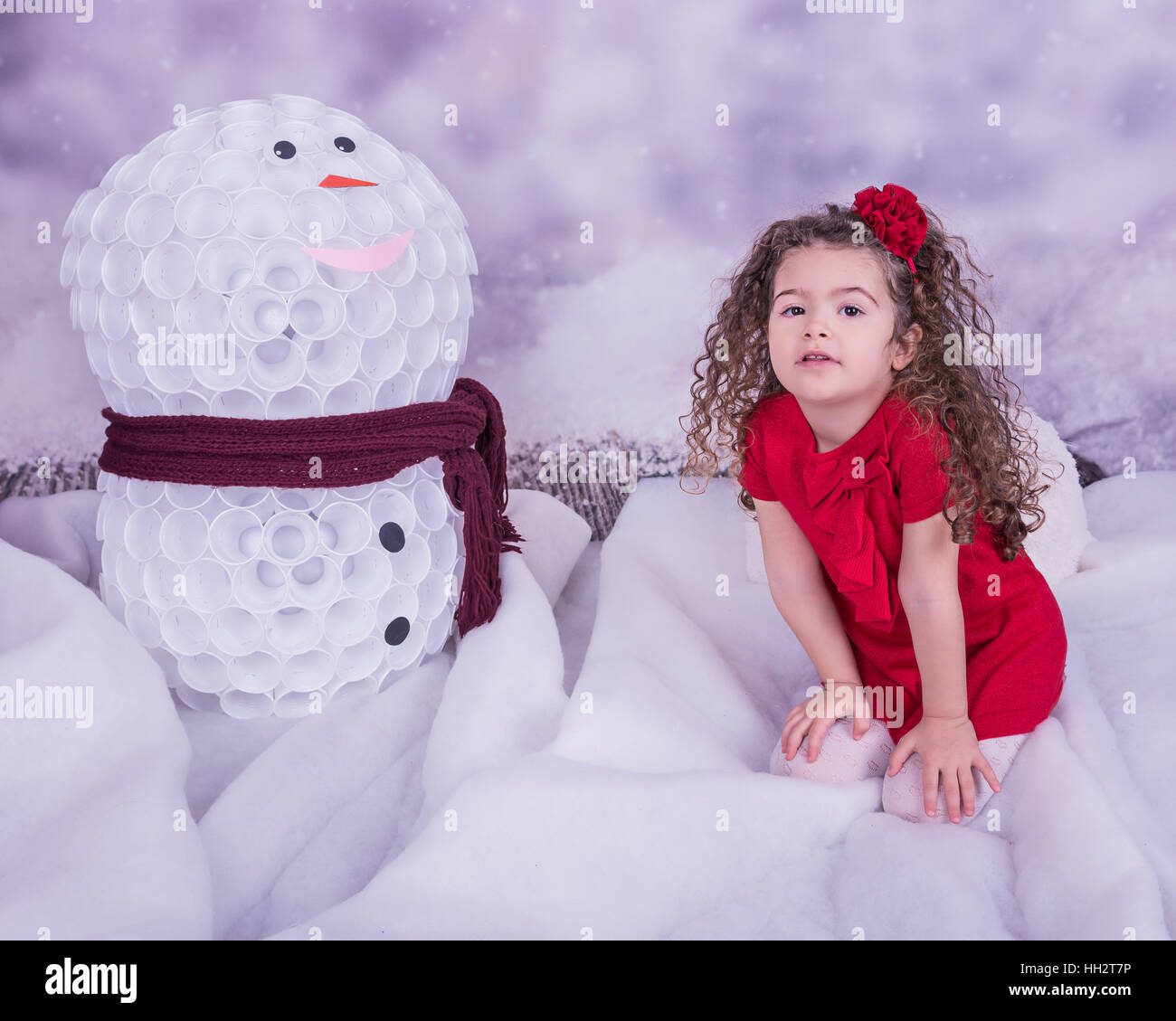 Portrait of pretty beautiful little girl in winter interior Stock Photo