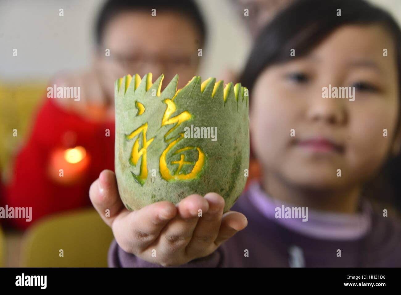 Liaocheng, China. 14th Jan, 2017. **EDITORIAL USE ONLY. CHINA OUT** Pupils show the turnip lanterns which they made under the guidance of students from Liaocheng University in Liaocheng, east China's Shandong Province, marking the upcoming Spring Festival and reviewing childhood memory. Credit: SIPA Asia/ZUMA Wire/Alamy Live News Stock Photo