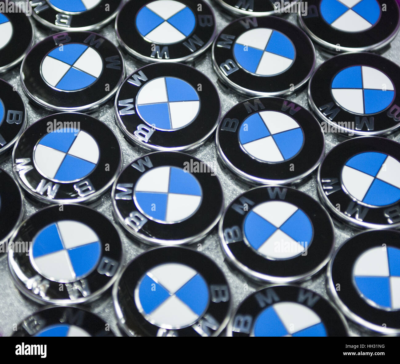 Regensburg, Germany. 10th Apr, 2013. Caps with the logo of BMW lie in a box at the factory of car manufacturer BMW in Regensburg, Germany, 10 April 2013. Photo: Marc Mueller | usage worldwide/dpa/Alamy Live News Stock Photo