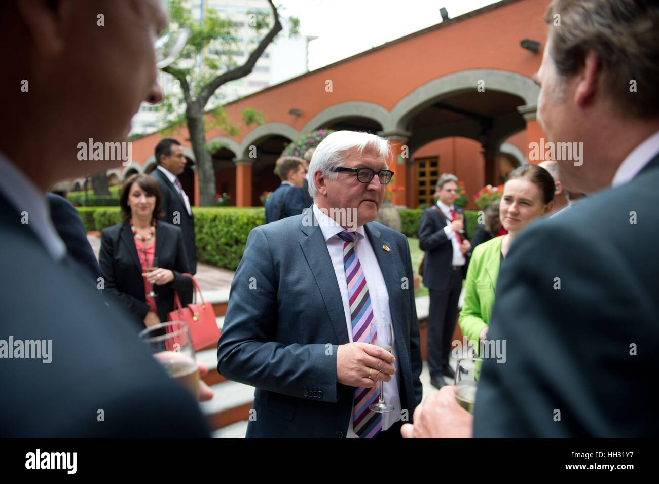 FILE - A file picture dated 17 July 2014 shows German Foreign Minister Frank-Walter Steinmeier (c, SPD) speaking to business representatives on the occasion of the signing of a new Kaufvertrag (lit. purchase contract) for the new BMW factory location in Mexico City, Mexico. Car manufacturer BMW plans to invest around 1 billion dollars in a new factory in San Luis Potosi. Photo: Bernd von Jutrczenka/dpa Stock Photo