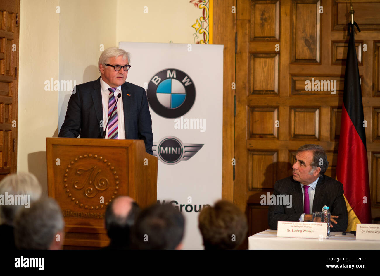 FILE - A file picture dated 17 July 2014 shows German Foreign Minister Frank-Walter Steinmeier (l, SPD) speaking next to Ludwig Willisch (r), president and manager of BMW Group America, on the occasion of the signing of a new Kaufvertrag (lit. purchase contract) for the new BMW factory location in Mexico City, Mexico. Car manufacturer BMW plans to invest around 1 billion dollars in a new factory in San Luis Potosi. Photo: Bernd von Jutrczenka/dpa Stock Photo