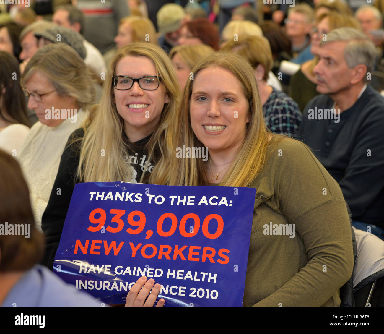 New York, USA. 15th Jan, 2017. Two sister hold sign 