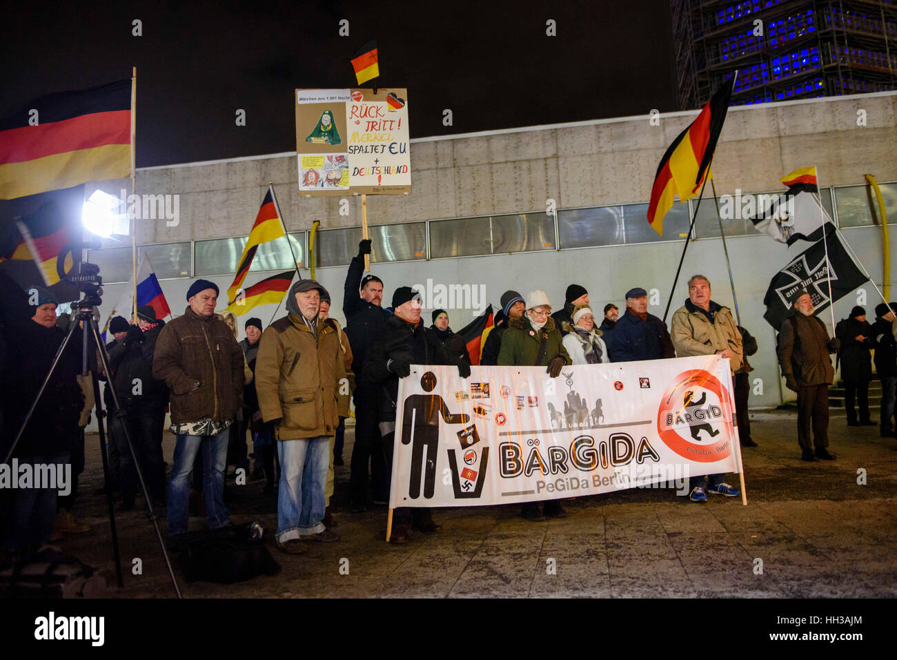 Berlin, Germany. 16th Jan, 2017. Supporters of the Baergida (Berlin Patriots Against the Islamization of the Occident) group hold signs and banners during a demonstration at Breitscheidplatz in Berlin, Germany, 16 January 2017. Photo: Gregor Fischer/dpa/Alamy Live News Stock Photo