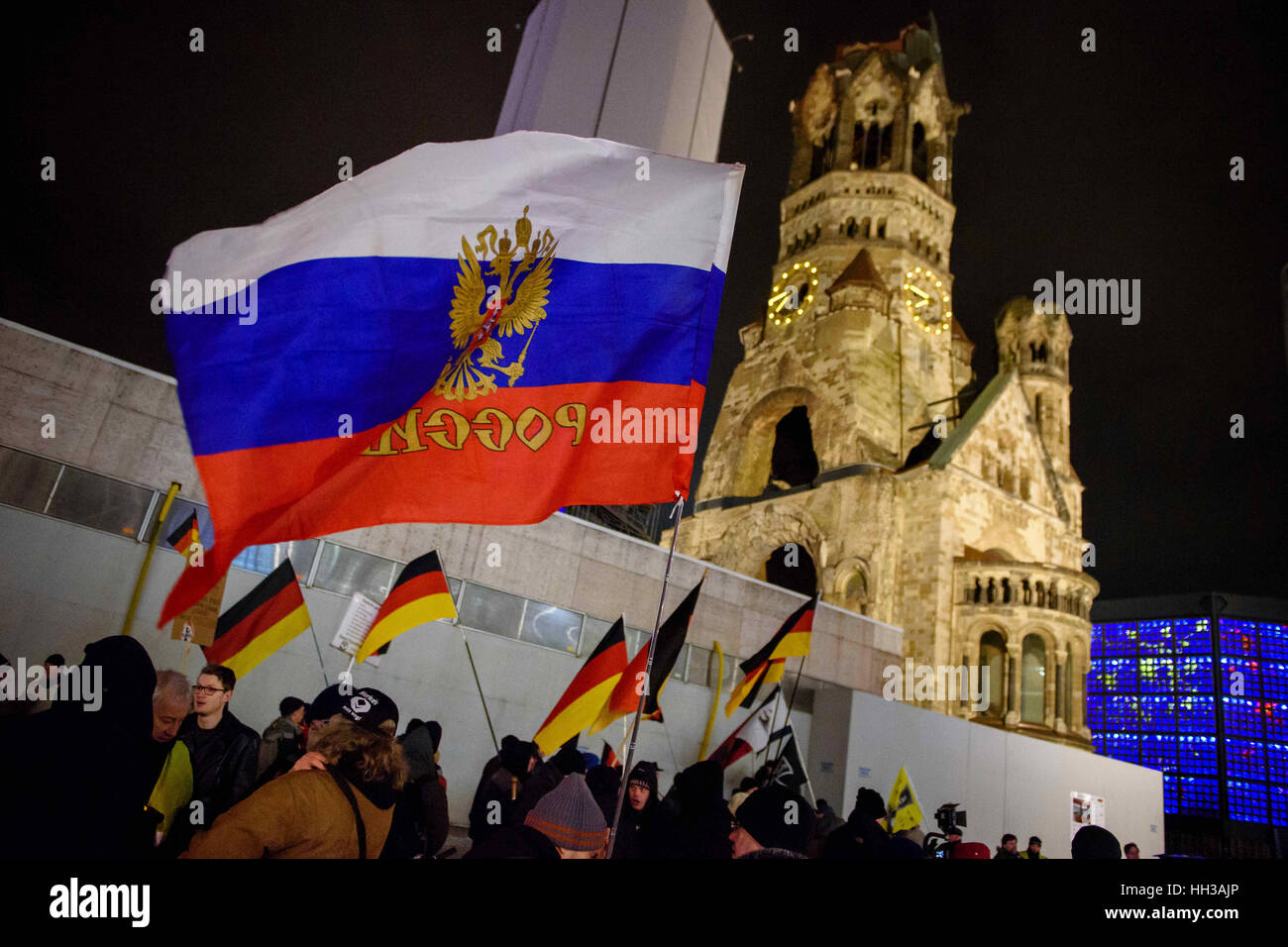 Berlin, Germany. 16th Jan, 2017. A Russian and several German flags at a demonstration by the Baergida (Berlin Patriots Against the Islamization of the Occident) group outside the Memorial Church at Breitscheidplatz in Berlin, Germany, 16 January 2017. Photo: Gregor Fischer/dpa/Alamy Live News Stock Photo