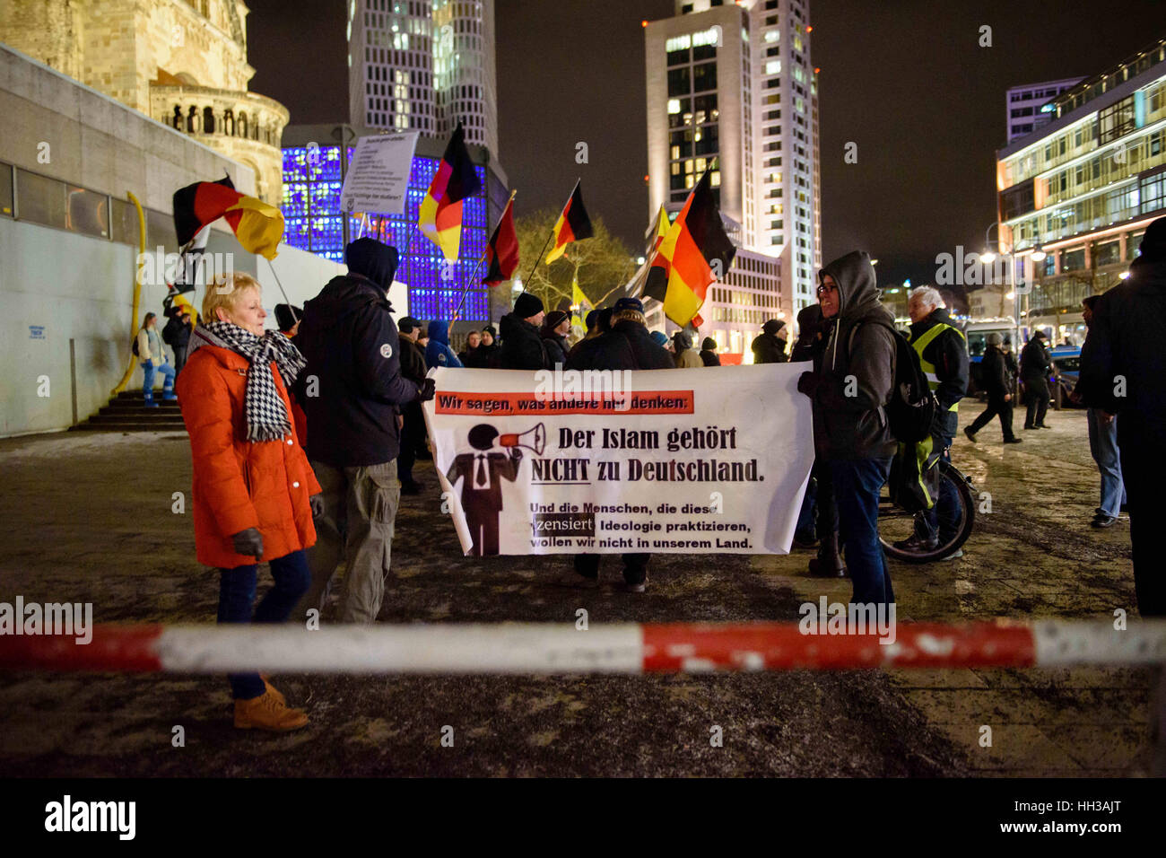 Berlin, Germany. 16th Jan, 2017. Supporters of the Baergida (Berlin Patriots Against the Islamization of the Occident) group hold flags and banners during a demonstration at Breitscheidplatz in Berlin, Germany, 16 January 2017. Photo: Gregor Fischer/dpa/Alamy Live News Stock Photo