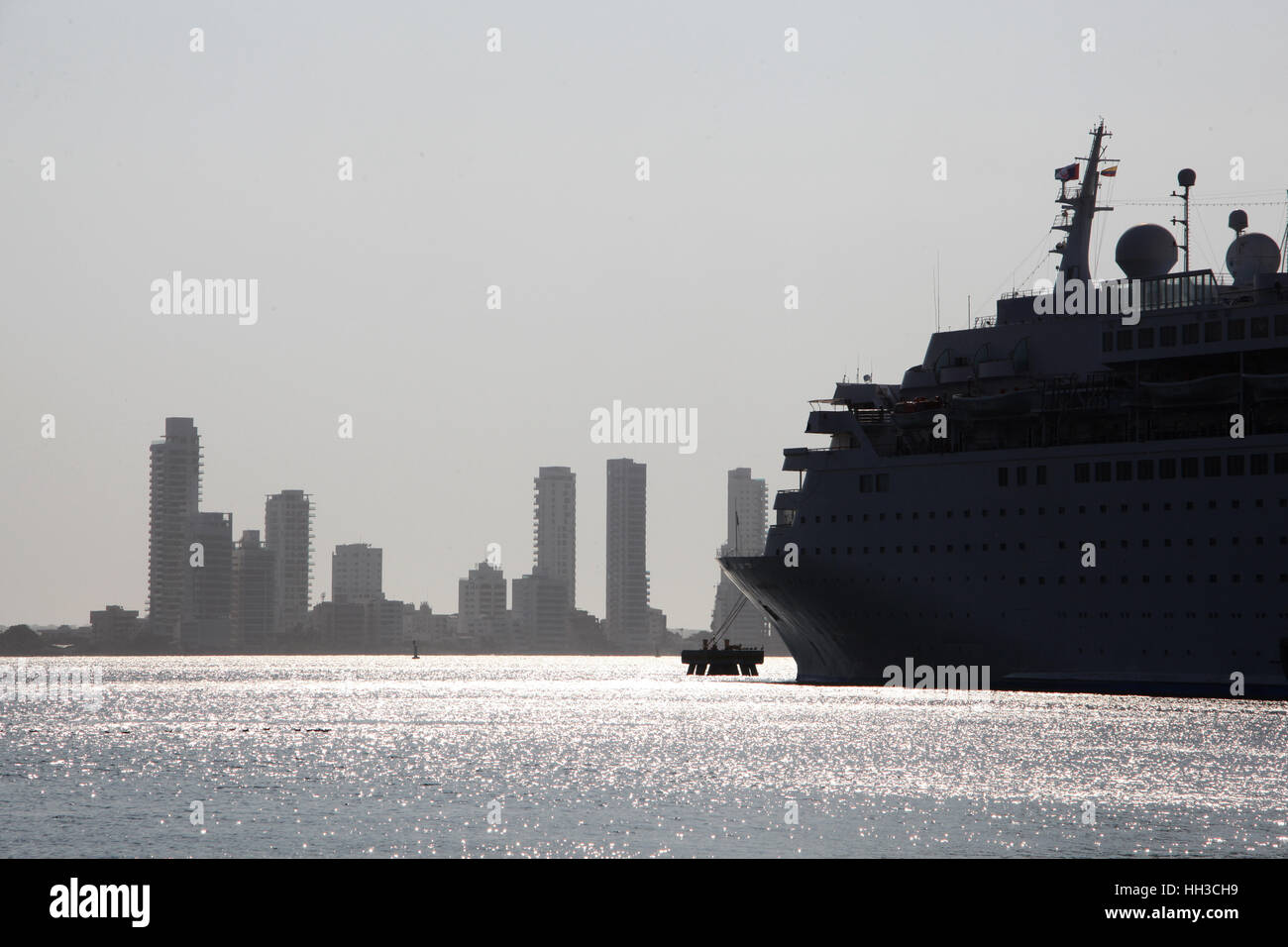 Cruise ship docked in front of the skyline of Cartagena, Colombia. Stock Photo